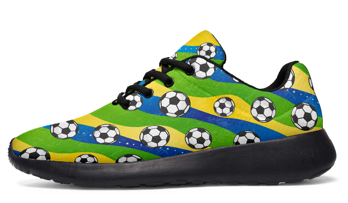 Brazil-inspired sport shoes featuring soccer ball patterns with green, yellow, and blue flag-inspired artwork.