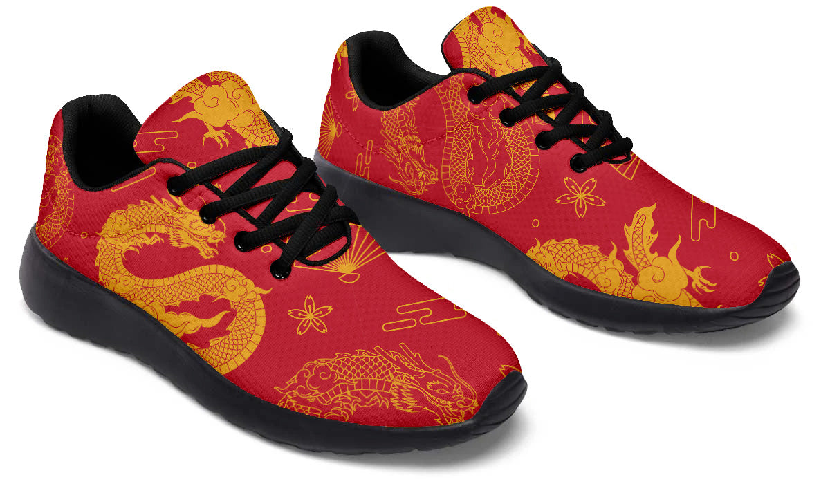 Red sport shoes featuring traditional golden Chinese dragon artwork with decorative cloud and floral pattern details.