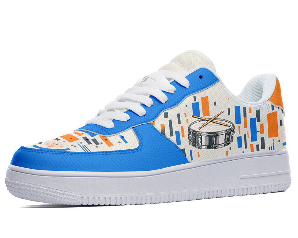 Court sneaker in white sole with a side view featuring a silver snare drum with drumsticks over blue and orange equalizer block patterns.