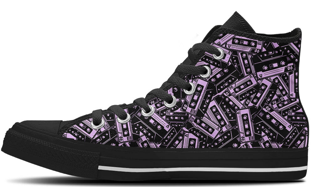 High Top sneaker in black sole with a side view featuring a repeating seamless pattern of purple and black retro cassette tapes.