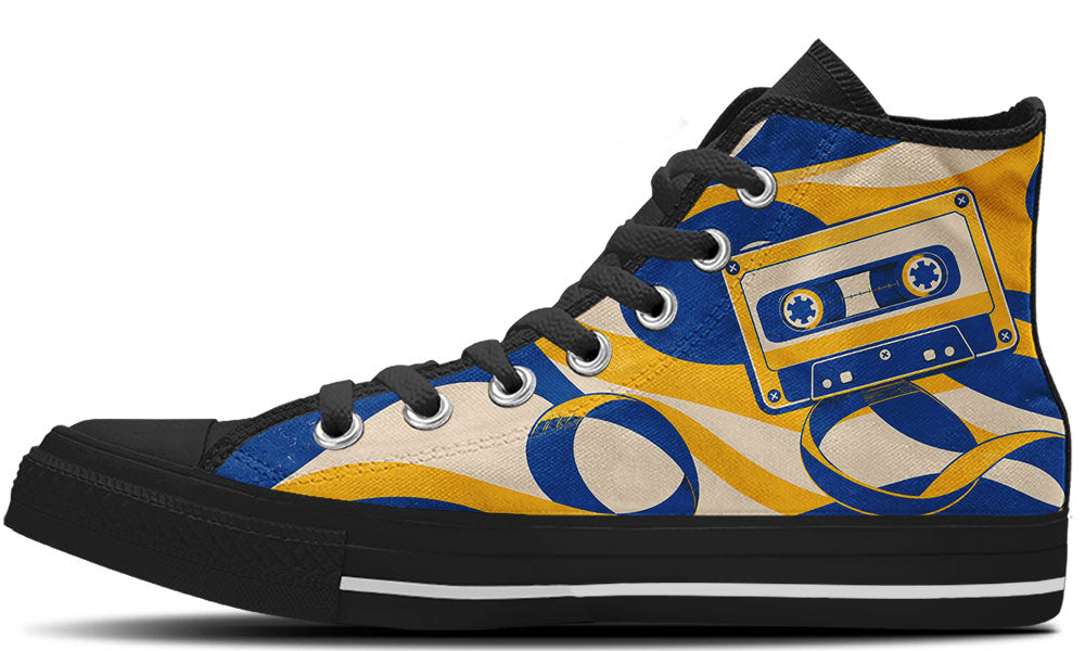 Classic high top sneaker featuring a blue and yellow cassette tape print with unraveling magnetic tape swirls, in black sole.