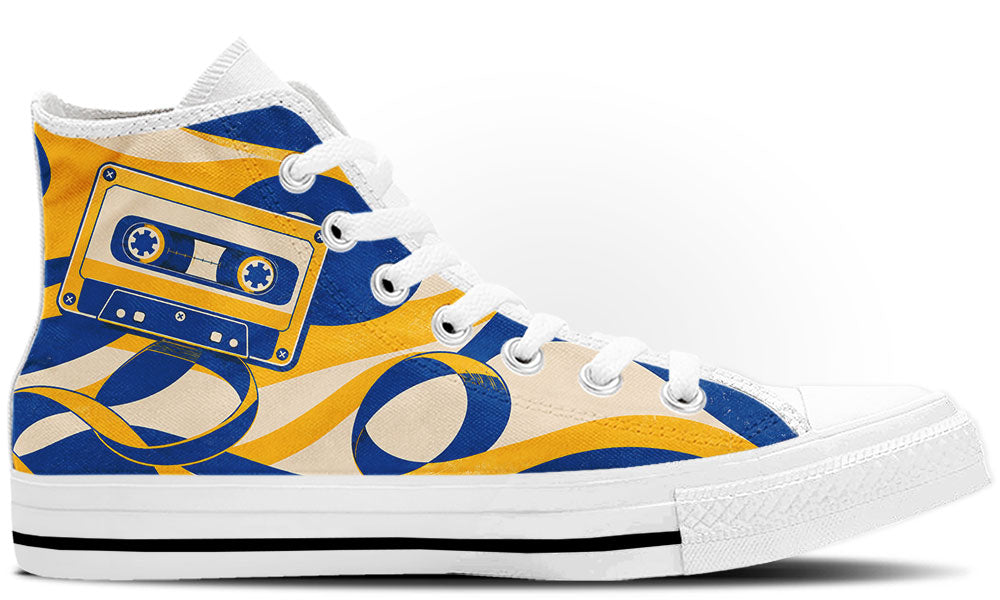Classic high top sneaker featuring a blue and yellow cassette tape print with unraveling magnetic tape swirls, in white sole.