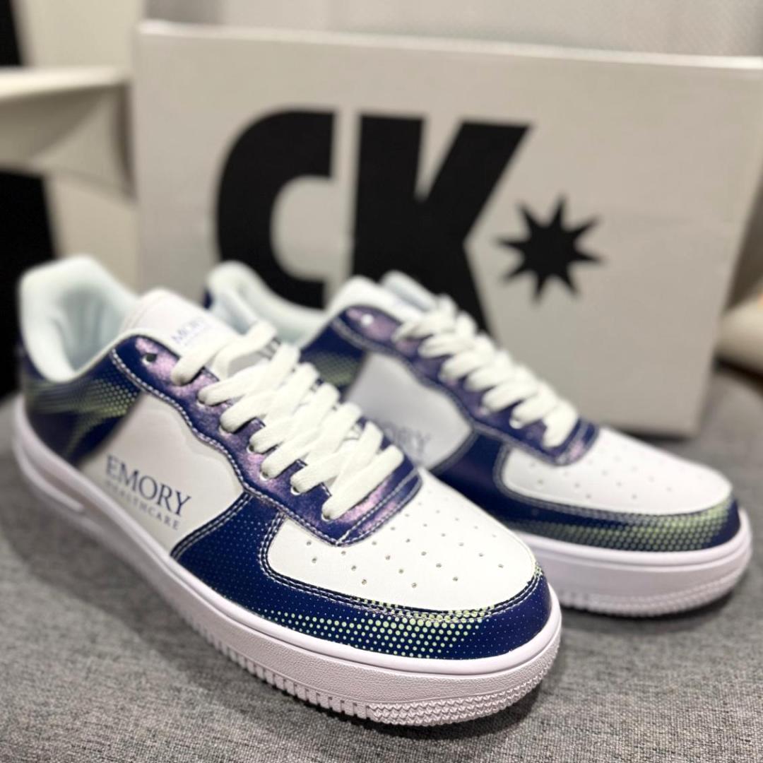 Company-branded sneakers showing the selected shoe style and design
