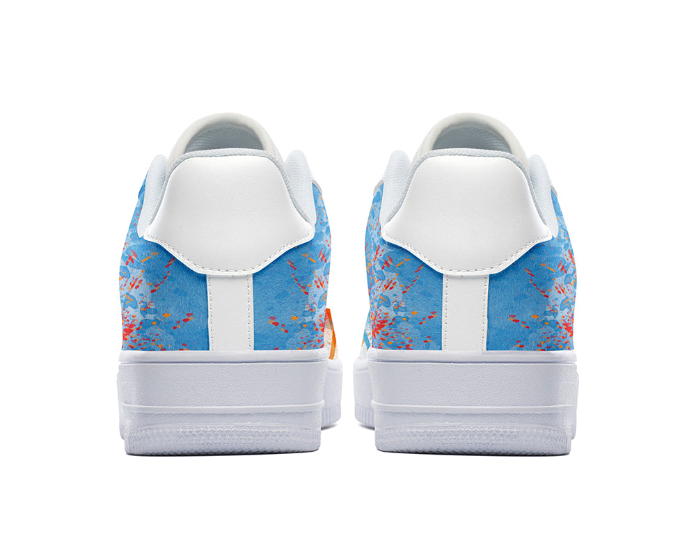 Court sneakers featuring colorful graffiti-inspired spray paint artwork with blue, orange, and red paint splatter details.