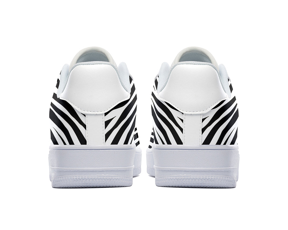 Court sneakers featuring classic black and white zebra print pattern artwork inspired by African wildlife.