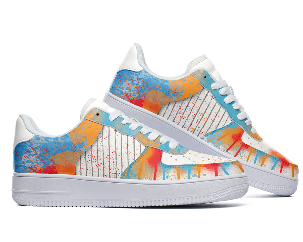 Court sneakers featuring colorful graffiti-inspired spray paint artwork with blue, orange, and red paint splatter details.