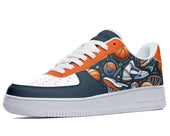 White, navy, and orange sneakers with a basketball-themed print.  The design features basketballs, sneakers, and basketball hoops. 
