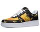 A black sneaker with a white sole and white laces. The sneaker has a design of bees and sunflowers on the upper.