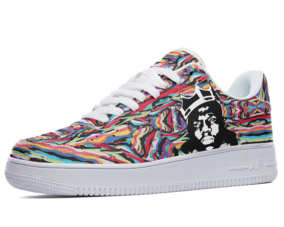 A colorful sneaker with a painting of a man wearing a crown on the side.