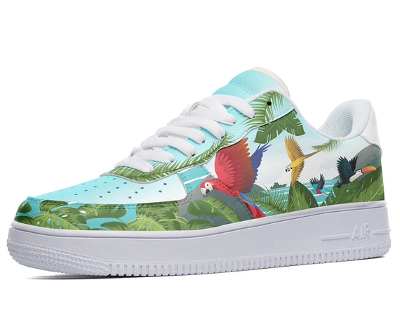 A white sneaker with a colorful design of a parrot, a toucan, and palm leaves on the side.