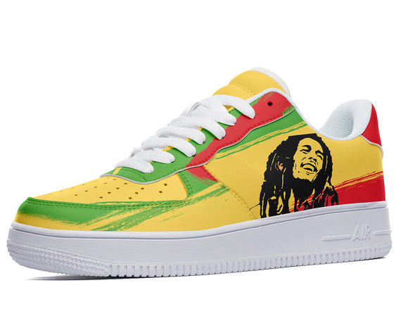 A close-up of a sneaker with a yellow and green upper and a white sole. The sneaker is decorated with a colorful image of Bob Marley, a Jamaican singer-songwriter.