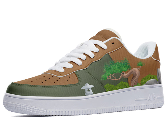 A close-up of a sneaker with a design of a tree and a stone lantern on the side. The sneaker is brown, green, and white.