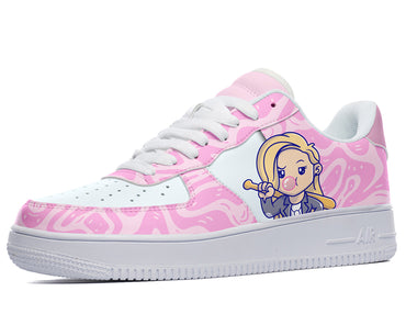 Pink sneakers with a cartoon woman with blonde hair holding a baseball bat and blowing a bubble. The shoes feature a pink and white swirl design. 