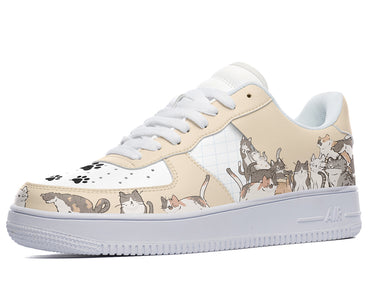 A white sneaker with a design of various cats in different colors and patterns on the upper.