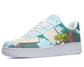 White sneakers with a blue, green, and brown design featuring a cartoon chameleon on a tree branch. 
