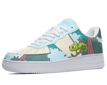 White sneakers with a blue, green, and brown design featuring a cartoon chameleon on a tree branch. 