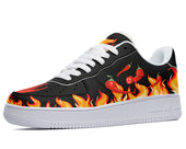 A black sneaker with a white sole and red chili peppers printed on the sides.