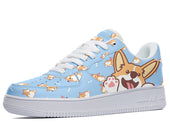 A pair of shoes with a light blue background and a pattern of cartoon corgis wearing party hats and sunglasses.