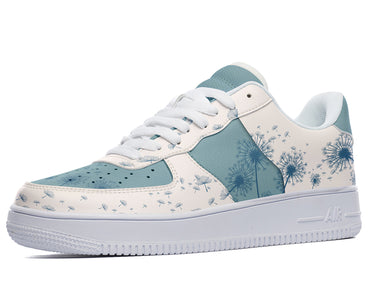 A white sneaker with a light blue dandelion print.