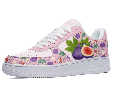 A pink sneaker with a white sole and laces. The sneaker has a design of purple figs, green leaves, and pink flowers on the sides.