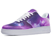 A low-top sneaker with a white sole and a purple, blue, and black upper that resembles a galaxy.