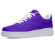 Purple sneakers with white laces and a white sole.
