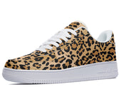 A close-up of a sneaker with a leopard print design. The sneaker is brown and black with a white sole and white laces.