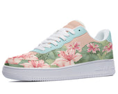 A close-up of a sneaker with a floral pattern on the upper. The sneaker has a white midsole and a light blue outsole.