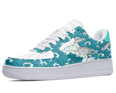 A white sneaker with a pattern of narwhals swimming in a blue ocean.