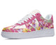 A pink and white sneaker with a floral pattern. The flowers are mostly purple and yellow.