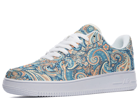 White sneakers with a blue and orange paisley pattern. 