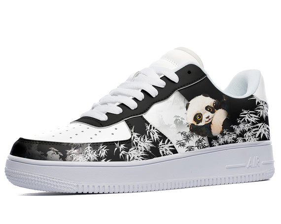 A close-up of a sneaker with a design of a panda sitting on a branch with bamboo in the background. The sneaker is white with black accents and a white sole.