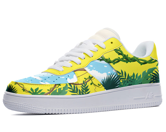 A yellow sneaker with a white sole, white laces, and a design of green leaves and vines on the upper.