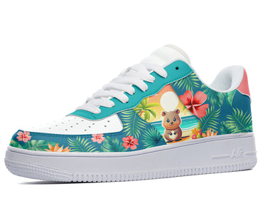 A white sneaker with a blue and green floral pattern. The pattern features a cartoon quokka on a beach, palm trees, and flowers.