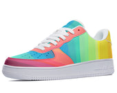 A low-top sneaker with a rainbow-colored gradient design on the upper and a white midsole and outsole.