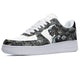 White sneakers with a black and silver design featuring a robotic figure and circuitry. 
