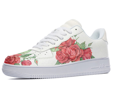 A white sneaker with a red rose design on the side.