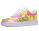 A white sneaker with a colorful pattern of fruits on the upper. The fruits include bananas, kiwi, and strawberries.