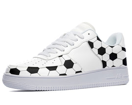 White sneakers with a black and white soccer ball pattern. 
