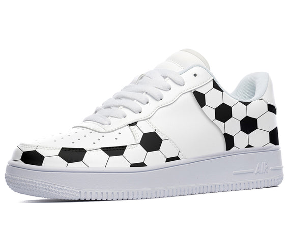 White sneakers with a black and white soccer ball pattern. 