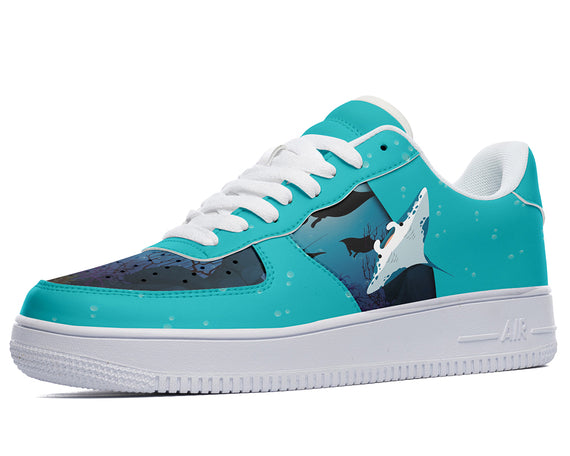 Teal sneakers with a manta ray design, white laces, and white soles. 