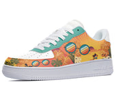 A white sneaker with a colorful design of palm trees, sunglasses, and a sunset on the sides.