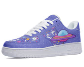 A left foot view of a sneaker with a purple upper and white sole. The upper is decorated with a pattern of planets, stars, and spaceships.