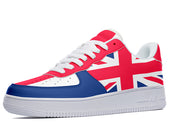 A low-top sneaker with a red, white, and blue color scheme. The sneaker has a white midsole and a blue outsole. The upper is made of red leather with white and blue accents. The sneaker is designed with the Union Jack flag on the side.