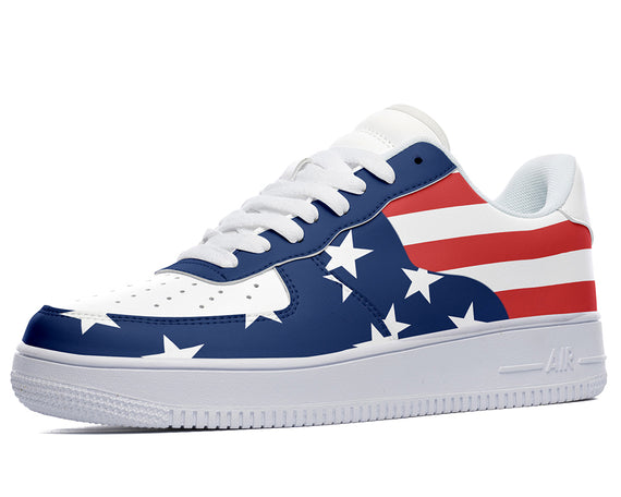 A low-top sneaker with a white sole, white laces, and a red, white, and blue American flag design on the upper.