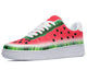 A close-up of a sneaker with a watermelon design. The sneaker is red, green, and white and has a white sole.