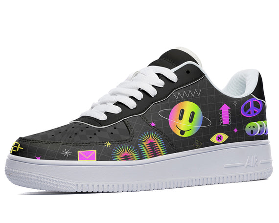 A black sneaker with a colorful design on the upper. The design features various elements such as smiley faces, peace signs, and geometric shapes.