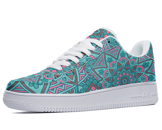 A mandala pattern in shades of blue and pink covers the upper of this shoe. The shoe has a white midsole and outsole.