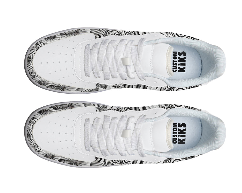 White court sneakers featuring black and white origami-inspired artwork with geometric paper-folding patterns and abstract monochrome design details.