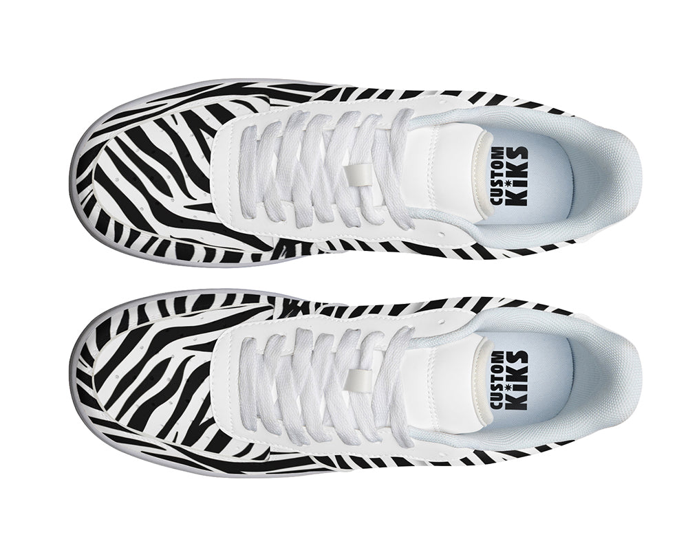 Court sneakers featuring classic black and white zebra print pattern artwork inspired by African wildlife.